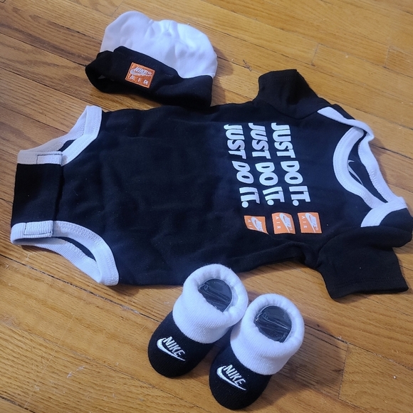 Nike® Size 0-6M 3-Piece Swoosh Bodysuit, Hat and Booties Set  - Picture 2 of 4